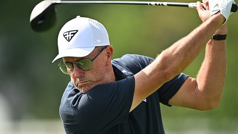 Sep 22, 2023; Sugar Grove, Illinois, USA; Phil Mickelson hits balls on the range during the first round of the LIV Golf Chicago golf tournament at Rich Harvest Farms. Mandatory Credit: Jamie Sabau-USA TODAY Sports
