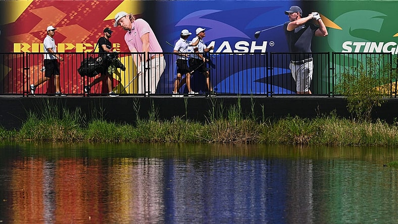 Sep 23, 2023; Sugar Grove, Illinois, USA; Sihwan Kim (far left) and James Piot and Phil Mickelson cross a bridge to the 17th green during the second round of the LIV Golf Chicago golf tournament at Rich Harvest Farms. Mandatory Credit: Jamie Sabau-USA TODAY Sports