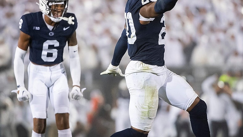 Penn State's Adisa Isaac celebrates after recovering a fumble during a White Out football game against Iowa Saturday, Sept. 23, 2023, in State College, Pa. The Nittany Lions shut out the Hawkeyes, 31-0.