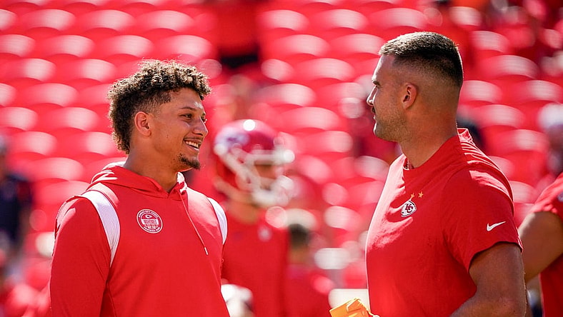 Sep 24, 2023; Kansas City, Missouri, USA; Kansas City Chiefs quarterback Patrick Mahomes (15) laughs with tight end Travis Kelce (87) against the Chicago Bears prior to a game at GEHA Field at Arrowhead Stadium. Mandatory Credit: Denny Medley-USA TODAY Sports