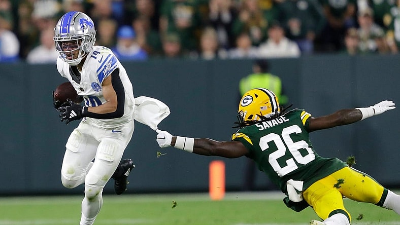 Detroit Lions wide receiver Amon-Ra St. Brown (14) gets past a tackle attempt by Green Bay Packers safety Darnell Savage (26) during their football game Thursday, September 28, 2023, at Lambeau Field in Green Bay, Wis. 
Dan Powers/USA TODAY NETWORK-Wisconsin.