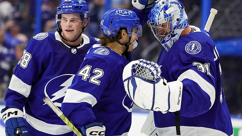Sep 29, 2023; Tampa, Florida, USA;  Tampa Bay Lightning goaltender Jonas Johansson (31) is congratulated by Tampa Bay Lightning center Felix Robert (42) and defenseman Jack Thompson (28) after beating the Carolina Hurricanes during preseason at Amalie Arena. Mandatory Credit: Nathan Ray Seebeck-USA TODAY Sports