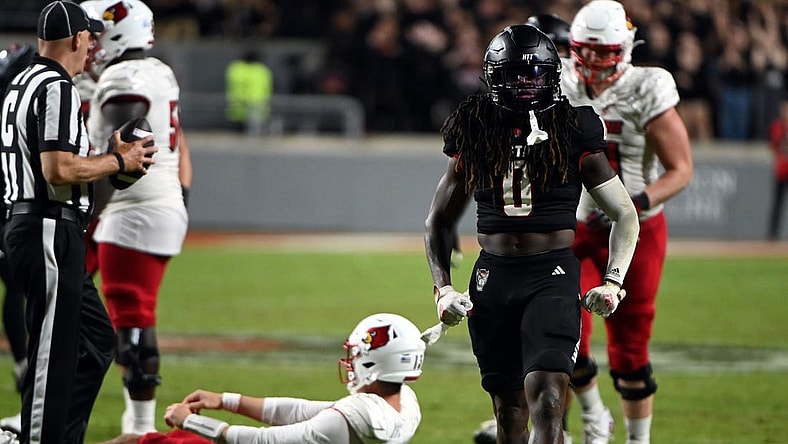 Sep 29, 2023; Raleigh, North Carolina, USA; North Carolina State Wolfpack safety Sean Brown (0) celebrates a sack during the second half against the Louisville Cardinals Mandatory Credit: Rob Kinnan-USA TODAY Sports at Carter-Finley Stadium. The Louisville Cardinals won 13-10.