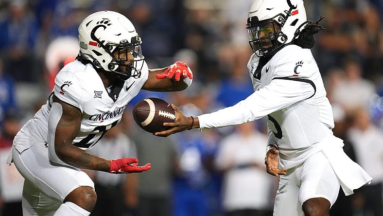 Cincinnati Bearcats quarterback Emory Jones (5) Cincinnati Bearcats running back Corey Kiner (21) in the first quarter during a college football game between the Brigham Young Cougars and the Cincinnati Bearcats, Friday, Sept. 29, 2023, at LaVell Edwards Stadium in Provo, Utah.