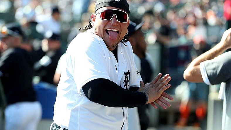 Detroit Tigers designated hitter Miguel Cabrera (24) jokes with a fan in the dugout during action against the Cleveland Guardians at Comerica Park in Detroit on Saturday, Sept. 30, 2023.