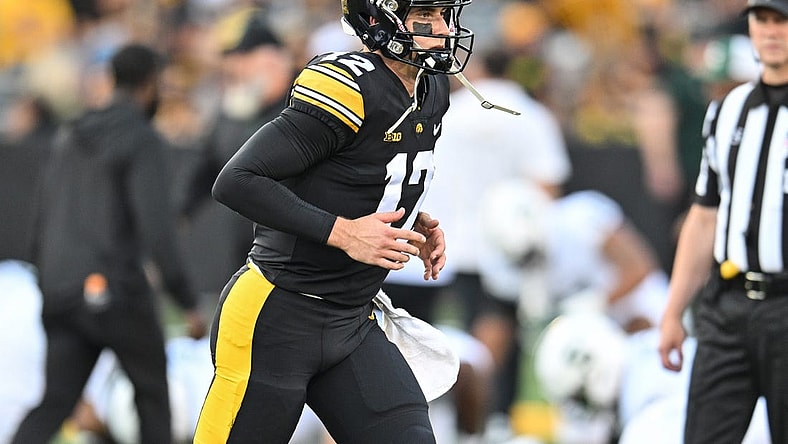 Sep 30, 2023; Iowa City, Iowa, USA; Iowa Hawkeyes quarterback Cade McNamara (12) warms up before the game against the Michigan State Spartans at Kinnick Stadium. Mandatory Credit: Jeffrey Becker-USA TODAY Sports