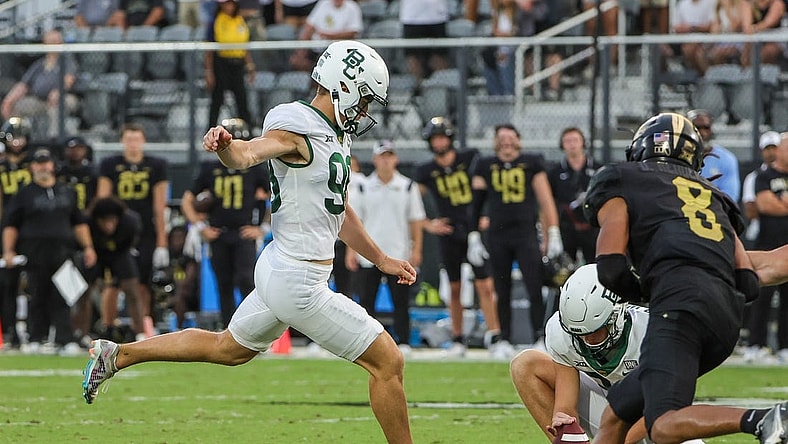 Sep 30, 2023; Orlando, Florida, USA; Baylor Bears kicker Isaiah Hankins (98) kicks a field goal to take the lead 36-35 during the fourth quarter at FBC Mortgage Stadium. Mandatory Credit: Mike Watters-USA TODAY Sports