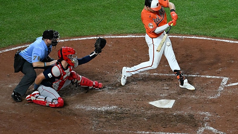 Sep 30, 2023; Baltimore, Maryland, USA;  Baltimore Orioles first baseman Ryan Mountcastle (6) hits a rbi double scoring  shortstop Jorge Mateo (3) in the seventh inning at Oriole Park at Camden Yards. Mandatory Credit: Tommy Gilligan-USA TODAY Sports