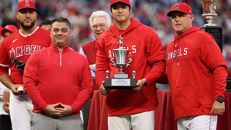 Sep 30, 2023; Anaheim, California, USA; Los Angeles Angels two-way player Shohei Ohtani (center) stands on the field with the Angels team MVP Award along with General Manager Perry Minasian (left) and Manager Phil Nevin (right) before the MLB baseball game against the Oakland Athletics at Angel Stadium. Mandatory Credit: Kiyoshi Mio-USA TODAY Sports