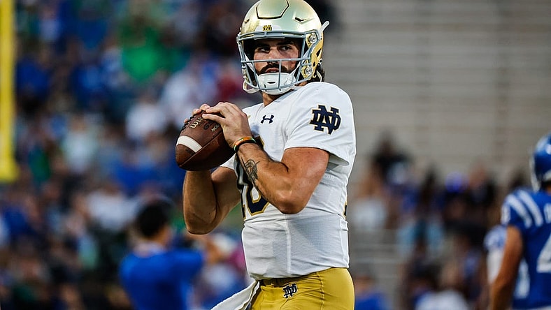 Sep 30, 2023; Durham, North Carolina, USA; Notre Dame Fighting Irish quarterback Sam Hartman (10) holds the football before the first half of the game against Duke Blue Devils at Wallace Wade Stadium. Mandatory Credit: Jaylynn Nash-USA TODAY Sports