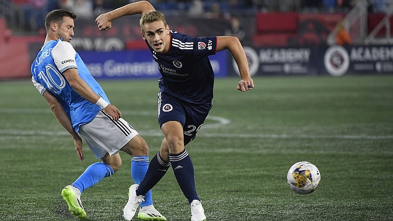 Sep 30, 2023; Foxborough, Massachusetts, USA;  Charlotte FC midfielder Brecht Dejaegere (10) and New England Revolution midfielder Noel Buck (29) battle for the ball during the first half at Gillette Stadium. Mandatory Credit: Bob DeChiara-USA TODAY Sports