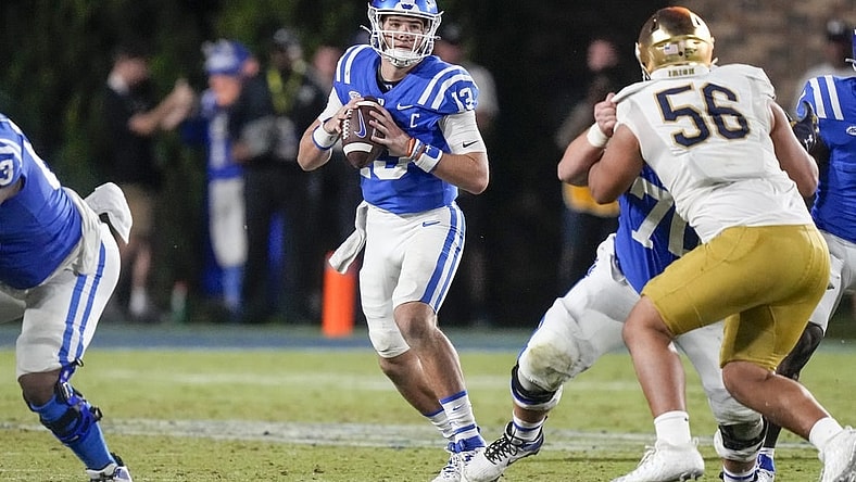 Sep 30, 2023; Durham, North Carolina, USA;Duke Blue Devils quarterback Riley Leonard (13) looks for a receiver  during the second half against the Notre Dame Fighting Irish at Wallace Wade Stadium. Mandatory Credit: Jim Dedmon-USA TODAY Sports