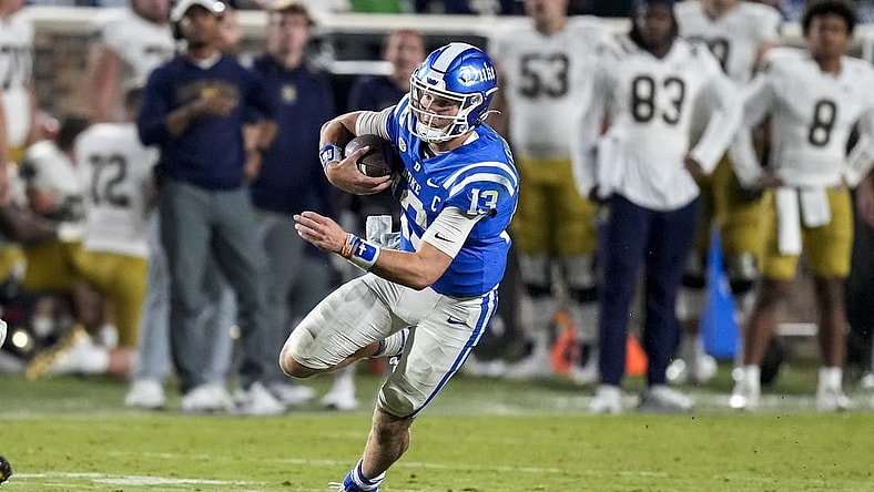 Sep 30, 2023; Durham, North Carolina, USA; Duke Blue Devils quarterback Riley Leonard (13) runs a keeper during the second half against the Notre Dame Fighting Irish at Wallace Wade Stadium. Mandatory Credit: Jim Dedmon-USA TODAY Sports