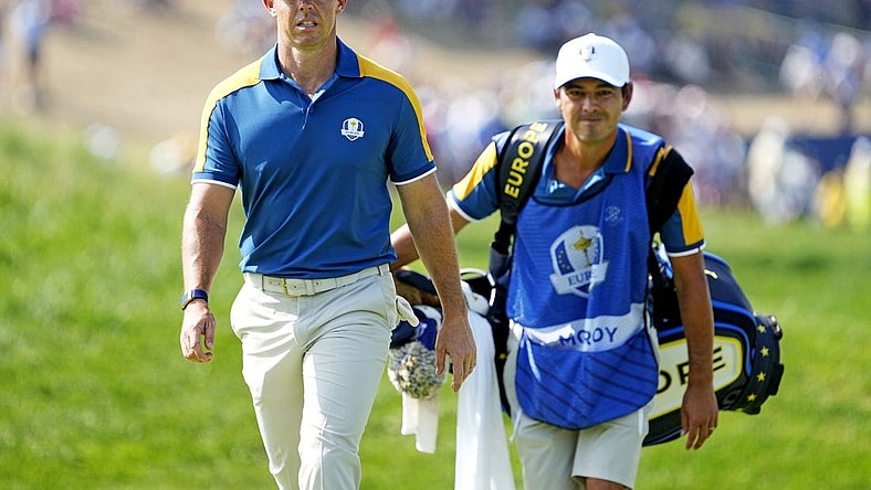 Oct 1, 2023; Rome, ITA; Team Europe golfer Rory McIlroy and his caddie Harry Diamond walk on on the first hole during the final day of the 44th Ryder Cup golf competition at Marco Simone Golf and Country Club. Mandatory Credit: Adam Cairns-USA TODAY Sports