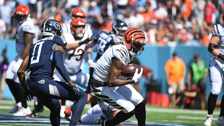 Oct 1, 2023; Nashville, Tennessee, USA; Cincinnati Bengals wide receiver Tee Higgins (5) runs after a catch during the first half against the Tennessee Titans at Nissan Stadium. Mandatory Credit: Christopher Hanewinckel-USA TODAY Sports