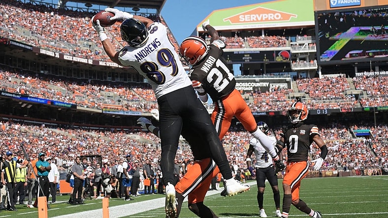 Oct 1, 2023; Cleveland, Ohio, USA; Baltimore Ravens tight end Mark Andrews (89) catches a touchdown as Cleveland Browns cornerback Denzel Ward (21) and safety Juan Thornhill (1) and cornerback Greg Newsome II (0) defend and during the first half at Cleveland Browns Stadium. Mandatory Credit: Ken Blaze-USA TODAY Sports