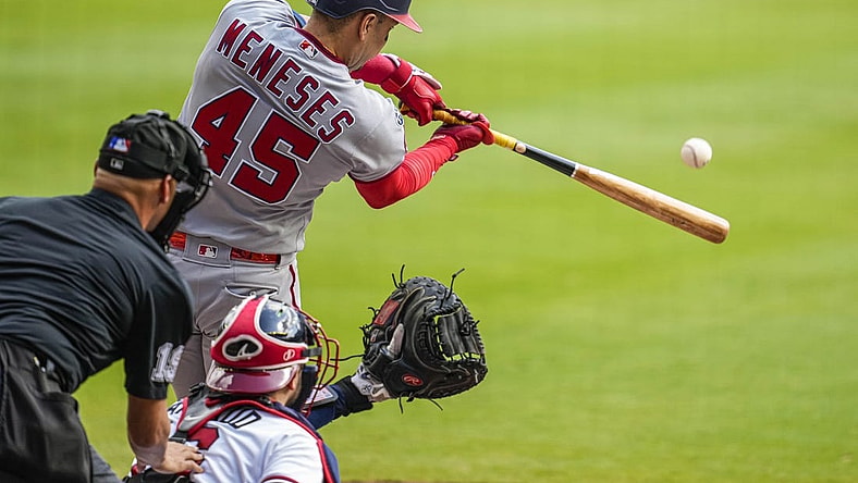 Oct 1, 2023; Cumberland, Georgia, USA; Washington Nationals first baseman Joey Meneses (45) hits a double to drive in a run against the Atlanta Braves during the first inning at Truist Park. Mandatory Credit: Dale Zanine-USA TODAY Sports