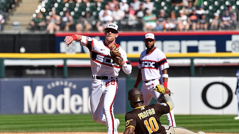Oct 1, 2023; Chicago, Illinois, USA; Chicago White Sox second baseman Zach Remillard (28) completes a double play while forcing out San Diego Padres left fielder Jurickson Profar (10) during the second inning at Guaranteed Rate Field. Mandatory Credit: Patrick Gorski-USA TODAY Sports