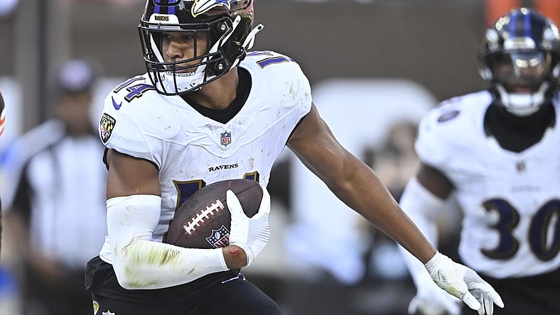 Oct 1, 2023; Cleveland, Ohio, USA; Baltimore Ravens safety Kyle Hamilton (14) runs after intercepting a pass in the fourth quarter against the Cleveland Browns at Cleveland Browns Stadium. Mandatory Credit: David Richard-USA TODAY Sports