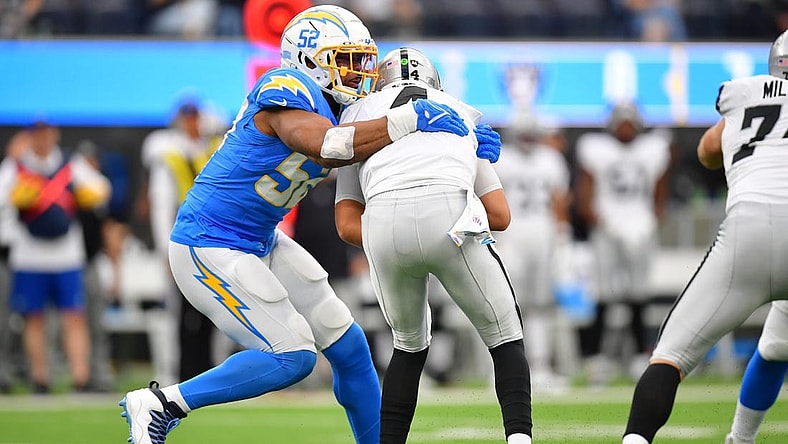Oct 1, 2023; Inglewood, California, USA; Los Angeles Chargers linebacker Khalil Mack (52) sacks Las Vegas Raiders quarterback Aidan O'Connell (4) during the first half at SoFi Stadium. Mandatory Credit: Gary A. Vasquez-USA TODAY Sports