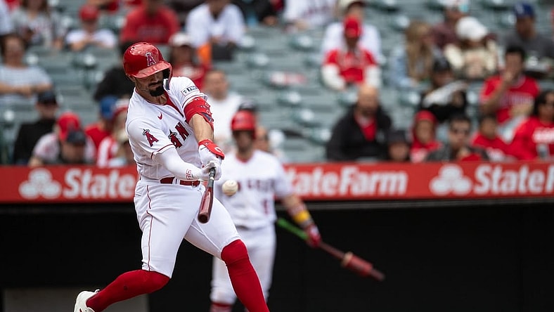Oct 1, 2023; Anaheim, California, USA; Los Angeles Angels left fielder Randal Grichuk (15) hits a home run against the Oakland Athletics during the third inning at Angel Stadium. Mandatory Credit: Jonathan Hui-USA TODAY Sports