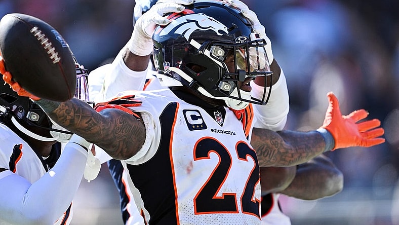 Oct 1, 2023; Chicago, Illinois, USA;  Denver Broncos safety Kareem Jackson (22) celebrates after intercepting a Chicago Bears pass in the fourth quarter at Soldier Field. Mandatory Credit: Jamie Sabau-USA TODAY Sports