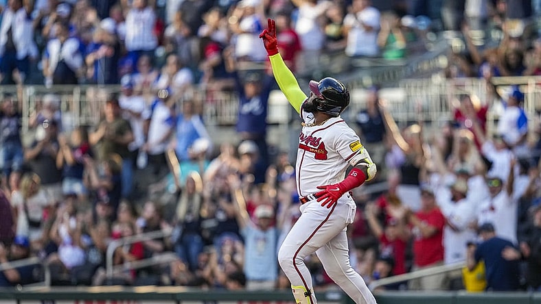 Oct 1, 2023; Cumberland, Georgia, USA; Atlanta Braves designated hitter Marcell Ozuna (20) reacts after hitting a home run against the Washington Nationals to tie the Major League team record for home runs hit in a season during the ninth inning at Truist Park. Mandatory Credit: Dale Zanine-USA TODAY Sports