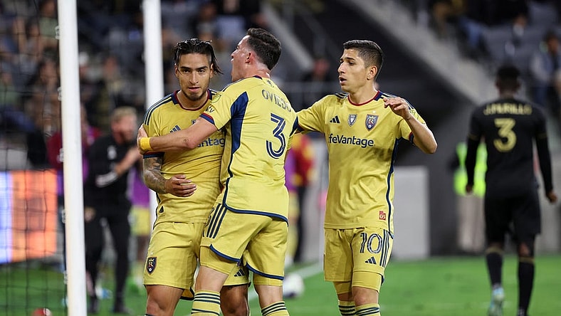 Oct 1, 2023; Los Angeles, California, USA;  Real Salt Lake forward Cristian Arango (9) celebrates with defender Bryan Oviedo (3) and forward Jefferson Savarino (10) after scoring a goal during the second half against the Los Angeles FC at BMO Stadium. Mandatory Credit: Kiyoshi Mio-USA TODAY Sports