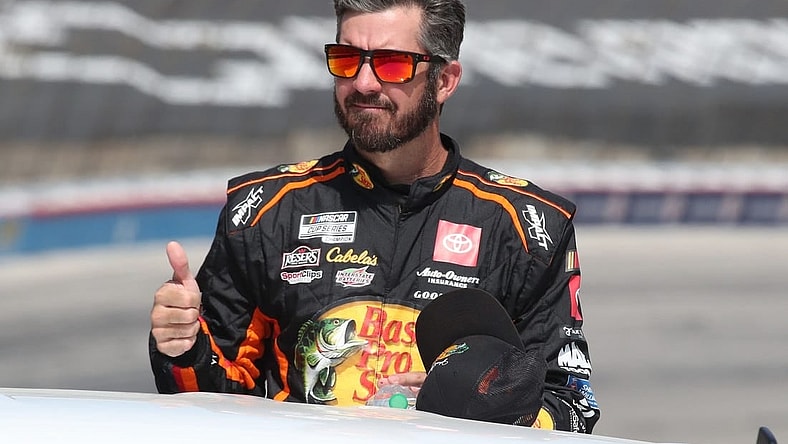 Sep 24, 2023; Fort Worth, Texas, USA;  NASCAR Cup Series driver  Martin Truex Jr. (19) during driver introductions before the AutoTrader EcoPark Automotive 400 at Texas Motor Speedway. Mandatory Credit: Michael C. Johnson-USA TODAY Sports
