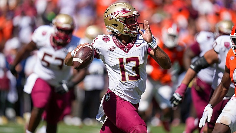 Sep 23, 2023; Clemson, South Carolina, USA; Florida State Seminoles quarterback Jordan Travis (13) in the second half against the Clemson Tigers at Memorial Stadium. Mandatory Credit: David Yeazell-USA TODAY Sports