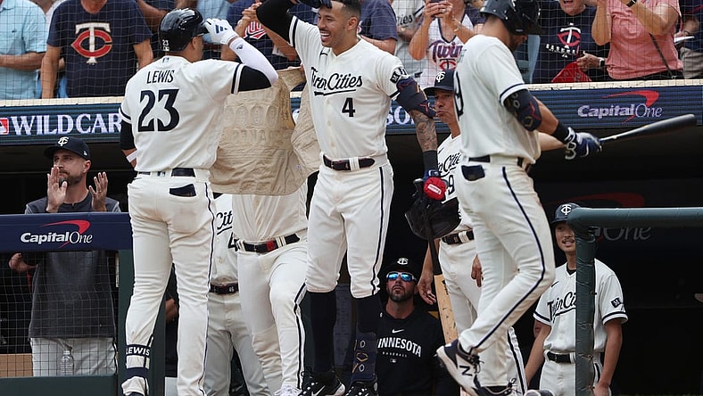 Oct 3, 2023; Minneapolis, Minnesota, USA; Minnesota Twins short stop Royce Lewis (23) celebrates with shortstop Carlos Correa after hitting a home run in the third inning against the Toronto Blue Jays during game one of the Wildcard series for the 2023 MLB playoffs at Target Field. Mandatory Credit: Jesse Johnson-USA TODAY Sports