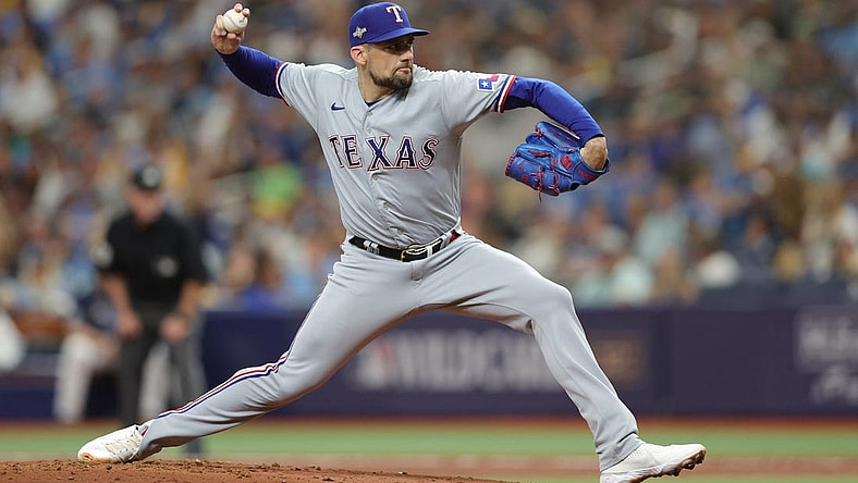 Oct 4, 2023; St. Petersburg, Florida, USA; Texas Rangers starting pitcher Nathan Eovaldi (17) pitches against the Tampa Bay Rays in the first inning during game two of the Wildcard series for the 2023 MLB playoffs at Tropicana Field. Mandatory Credit: Nathan Ray Seebeck-USA TODAY Sports