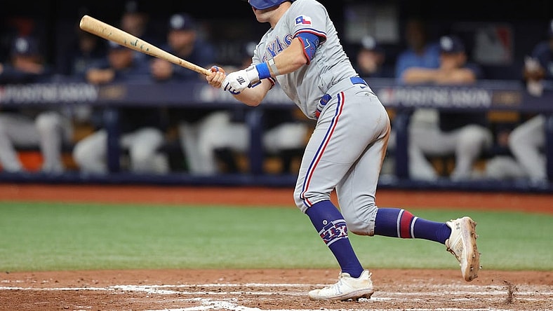 Oct 4, 2023; St. Petersburg, Florida, USA; Texas Rangers third baseman Josh Jung (6) hits a ground rule double against the Tampa Bay Rays in the sixth inning during game two of the Wildcard series for the 2023 MLB playoffs at Tropicana Field. Mandatory Credit: Nathan Ray Seebeck-USA TODAY Sports