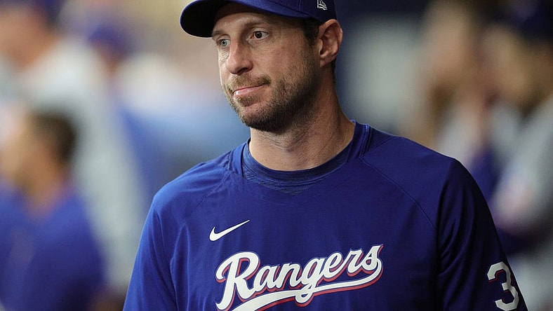 Oct 4, 2023; St. Petersburg, Florida, USA; Texas Rangers starting pitcher Max Scherzer (31) is seen in the dugout during game two of the Wildcard series for the 2023 MLB playoffs against the Tampa Bay Rays at Tropicana Field. Mandatory Credit: Nathan Ray Seebeck-USA TODAY Sports
