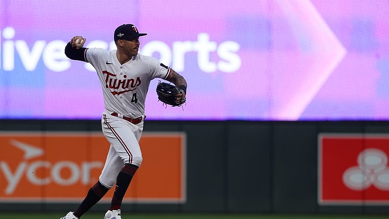 Oct 4, 2023; Minneapolis, Minnesota, USA; Minnesota Twins shortstop Carlos Correa (4) throws to first for an out in the eighth inning against the Toronto Blue Jays during game two of the Wildcard series for the 2023 MLB playoffs at Target Field. Mandatory Credit: Jesse Johnson-USA TODAY Sports