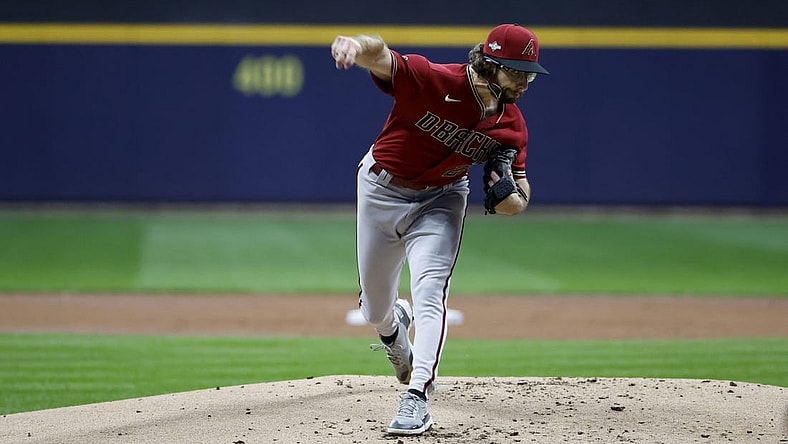 Oct 4, 2023; Milwaukee, Wisconsin, USA; Arizona Diamondbacks starting pitcher Zac Gallen (23) pitches against the Milwaukee Brewers in the first inning during game two of the Wildcard series for the 2023 MLB playoffs at American Family Field. Mandatory Credit: Kamil Krzaczynski-USA TODAY Sports