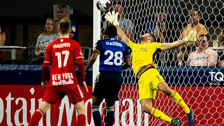 New York Red Bulls forward Elias Manoel (11) ball gets passed FC Cincinnati goalkeeper Alec Kann (1) for a goal in the first half of the MLS match between FC Cincinnati and New York Red Bulls at TQL Stadium in Cincinnati on Wednesday, Oct. 4, 2023.