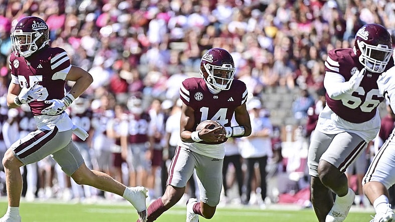 Oct 7, 2023; Starkville, Mississippi, USA; Mississippi State Bulldogs quarterback Mike Wright (14) runs the ball against the Western Michigan Broncos during the first quarter at Davis Wade Stadium at Scott Field. Mandatory Credit: Matt Bush-USA TODAY Sports