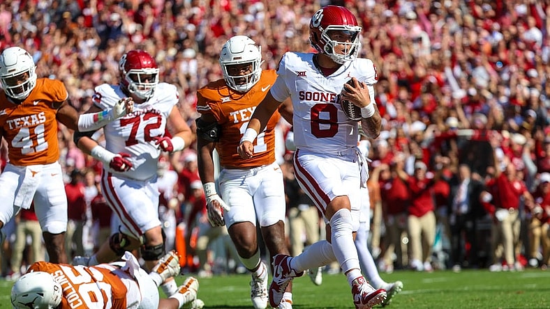 Oct 7, 2023; Dallas, Texas, USA;  Oklahoma Sooners quarterback Dillon Gabriel (8) runs for a touchdown during the first half against the Texas Longhorns at the Cotton Bowl. Mandatory Credit: Kevin Jairaj-USA TODAY Sports