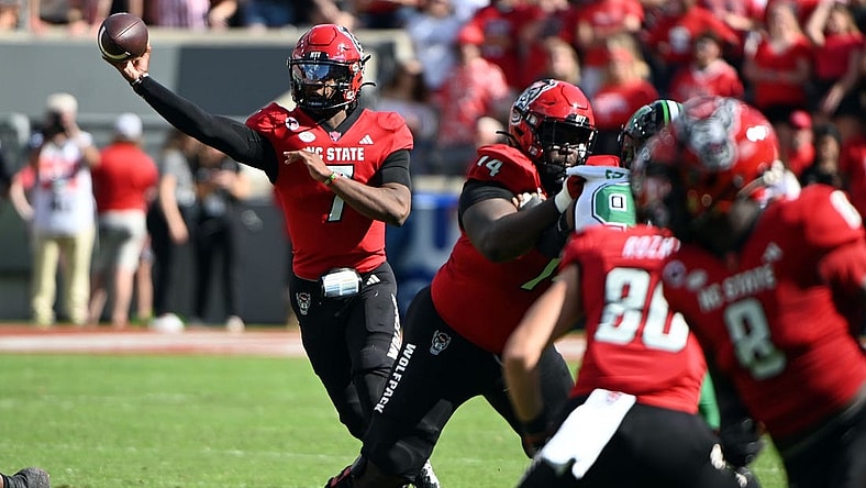 Oct 7, 2023; Raleigh, North Carolina, USA; North Carolina State Wolfpack quarterback MJ Morris (7) throws a pass during the first half against the Marshall Thundering Herd at Carter-Finley Stadium. Mandatory Credit: Rob Kinnan-USA TODAY Sports