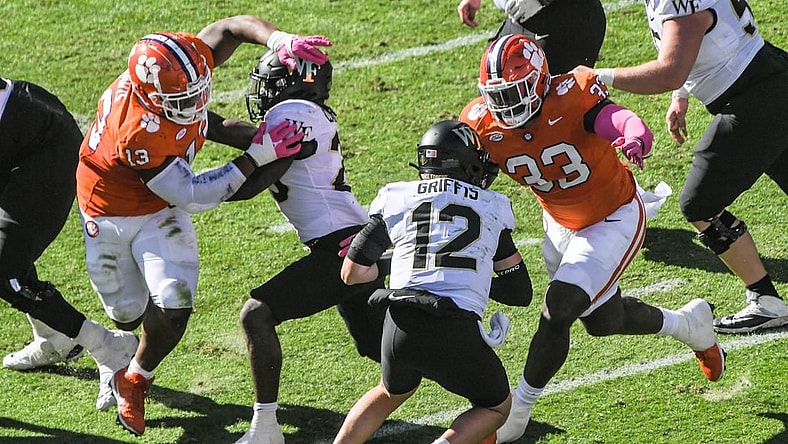 Oct 7, 2023; Clemson, South Carolina, USA; Clemson defensive tackle Ruke Orhorhoro (33) sacks  Wake Forest quarterback Mitch Griffis (12) during the first quarter at Memorial Stadium. Mandatory Credit: Ken Ruinard-USA TODAY Sports