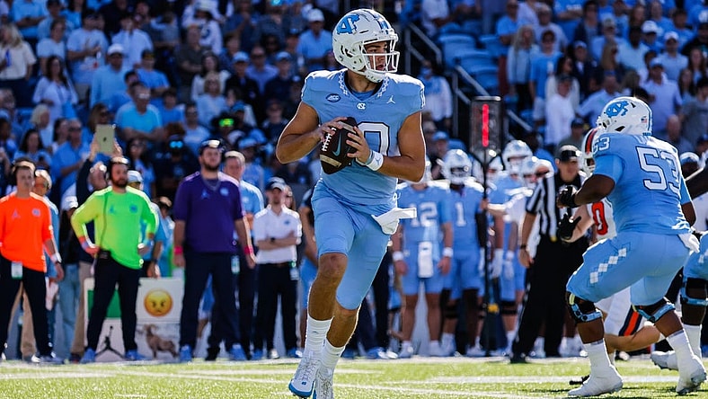 Oct 7, 2023; Chapel Hill, North Carolina, USA; North Carolina Tar Heels quarterback Drake Maye (10) runs the ball during the first half of the game against the Syracuse Orange at Kenan Memorial Stadium. Mandatory Credit: Jaylynn Nash-USA TODAY Sports