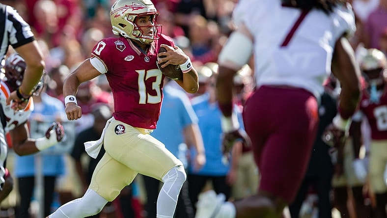Florida State Seminoles quarterback Jordan Travis (13) makes a dash towards the end zone. The Florida State Seminoles lead the Virginia Tech Hokies 22-10 at the half on Saturday, Oct. 7, 2023.