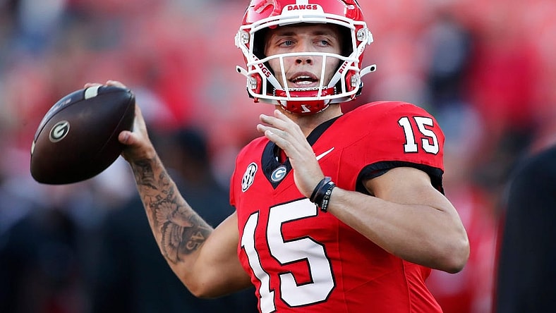 Georgia quarterback Carson Beck (15) warms up before the start of a NCAA college football game against Kentucky in Athens, Ga., on Saturday, Oct. 7, 2023.