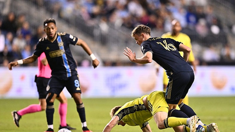 Oct 7, 2023; Philadelphia, Pennsylvania, USA; Philadelphia Union midfielder Jack McGlynn (16) and Nashville SC midfielder Dax McCarty (6) battle for position in the first half at Subaru Park. Mandatory Credit: Kyle Ross-USA TODAY Sports