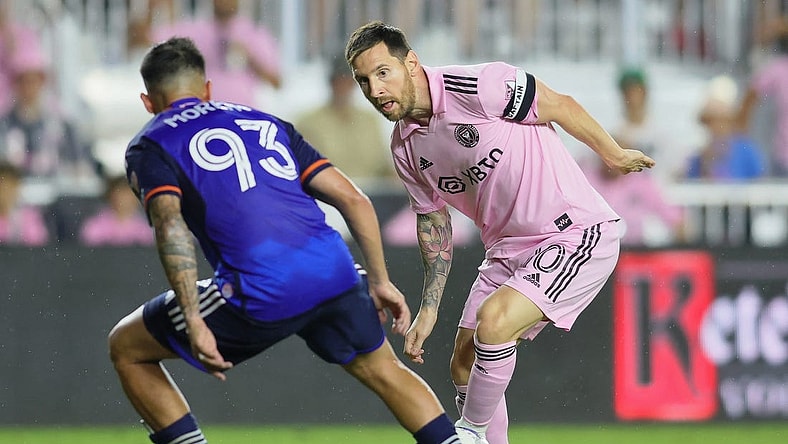 Oct 7, 2023; Fort Lauderdale, Florida, USA; Inter Miami CF forward Lionel Messi (10) dribbles the ball against FC Cincinnati midfielder Junior Moreno (93) during the second half at DRV PNK Stadium. Mandatory Credit: Sam Navarro-USA TODAY Sports