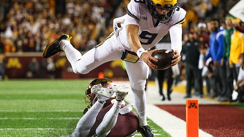 Oct 7, 2023; Minneapolis, Minnesota, USA; Michigan Wolverines quarterback J.J. McCarthy (9) dives for a  touchdown against the Minnesota Golden Gophers during the second quarter at Huntington Bank Stadium. Mandatory Credit: Matt Krohn-USA TODAY Sports