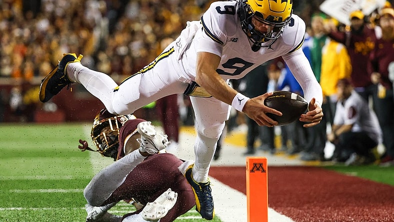 Oct 7, 2023; Minneapolis, Minnesota, USA; Michigan Wolverines quarterback J.J. McCarthy (9) dives for a  touchdown against the Minnesota Golden Gophers during the second quarter at Huntington Bank Stadium. Mandatory Credit: Matt Krohn-USA TODAY Sports