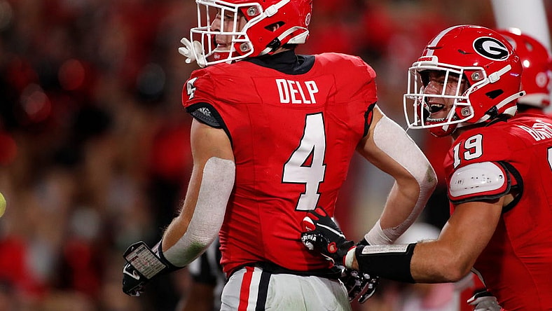 Georgia tight end Oscar Delp (4) celebrates after scoring touchdown during the first half of a NCAA college football game against Kentucky in Athens, Ga., on Saturday, Oct. 7, 2023.