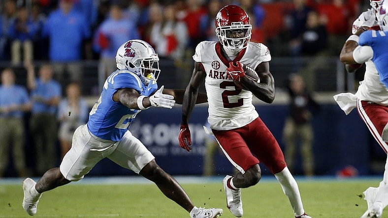 Oct 7, 2023; Oxford, Mississippi, USA; Arkansas Razorbacks wide receiver Andrew Armstrong (2) runs after a catch as Mississippi Rebels defensive back Trey Washington (25) makes the tackle during the first half at Vaught-Hemingway Stadium. Mandatory Credit: Petre Thomas-USA TODAY Sports